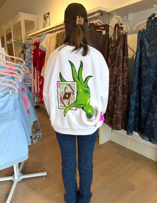 Queen of Sparkles White &
Green Grinch Hand Holding QOS
Card Sweatshirt