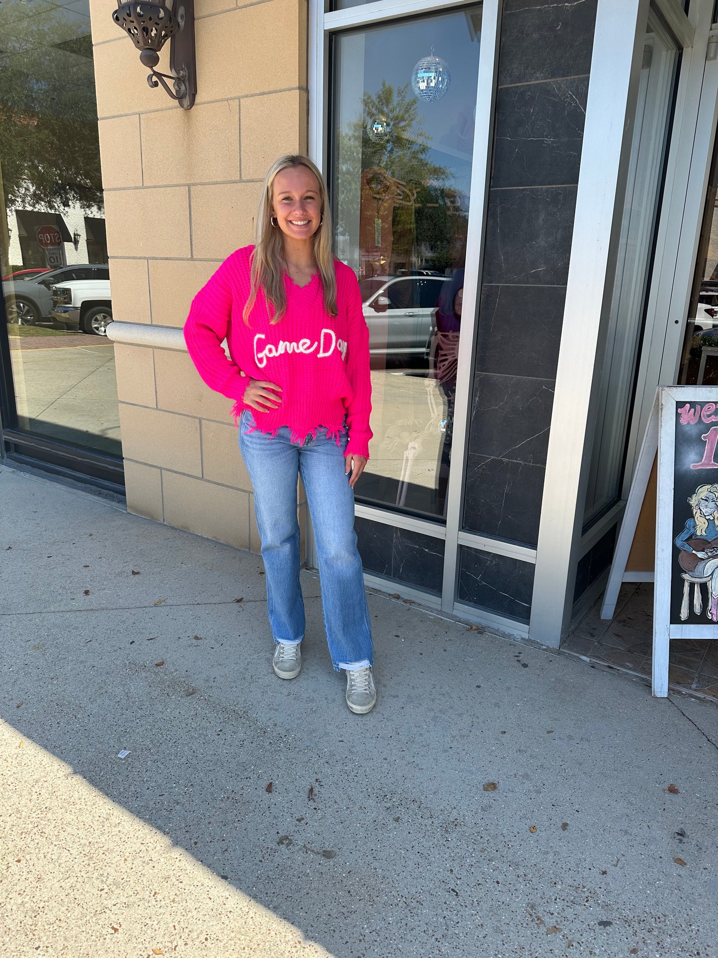 The City Sweater in hot pink with gameday script